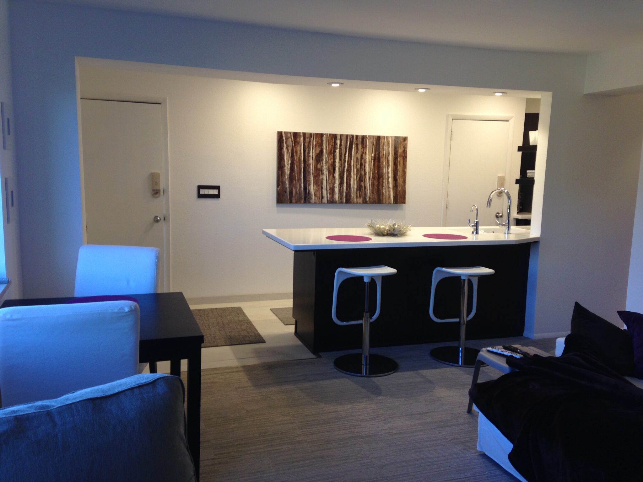 Modern apartment kitchen with island and stools